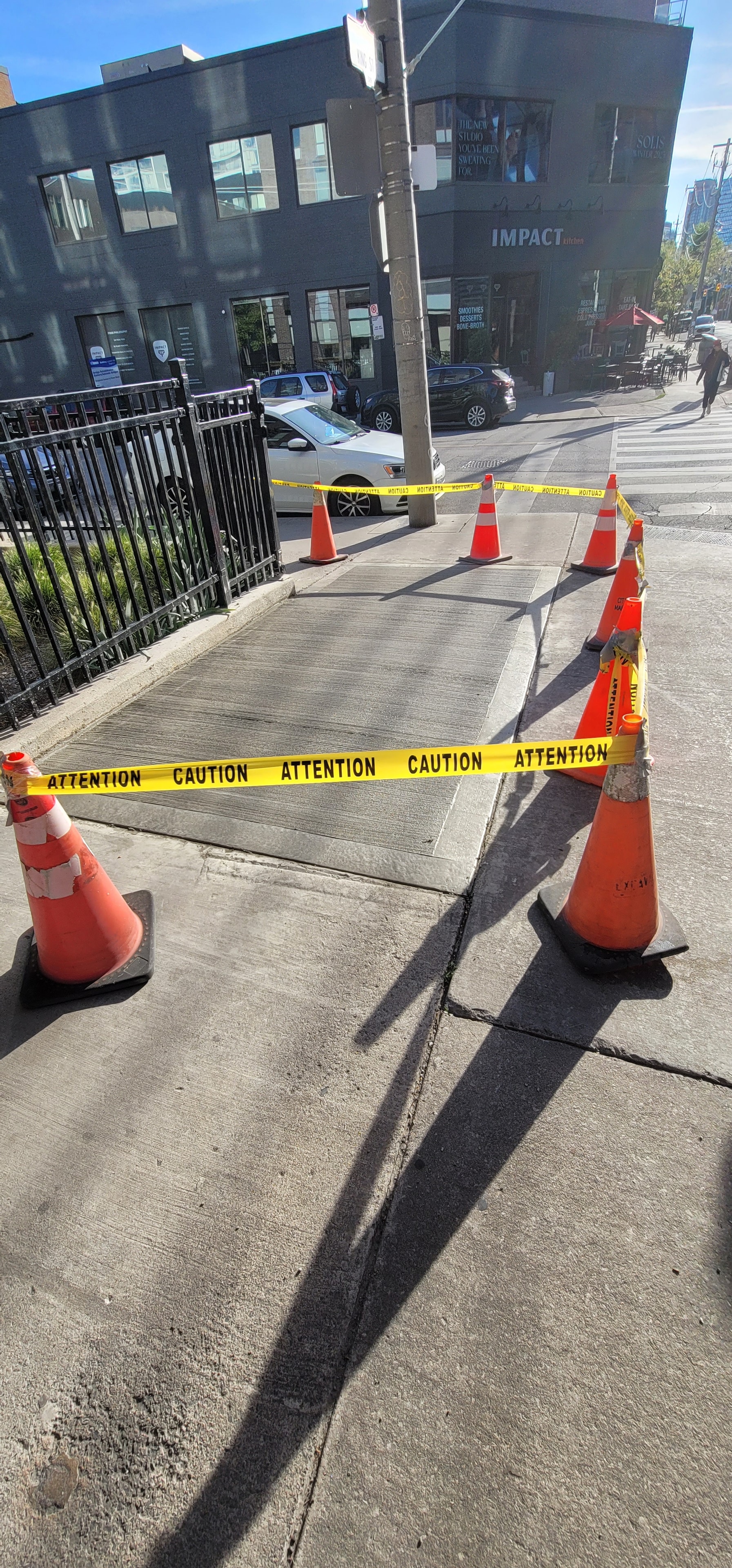Sidewalk Repair — Caution Tape & Cones, Urban Commercial Site