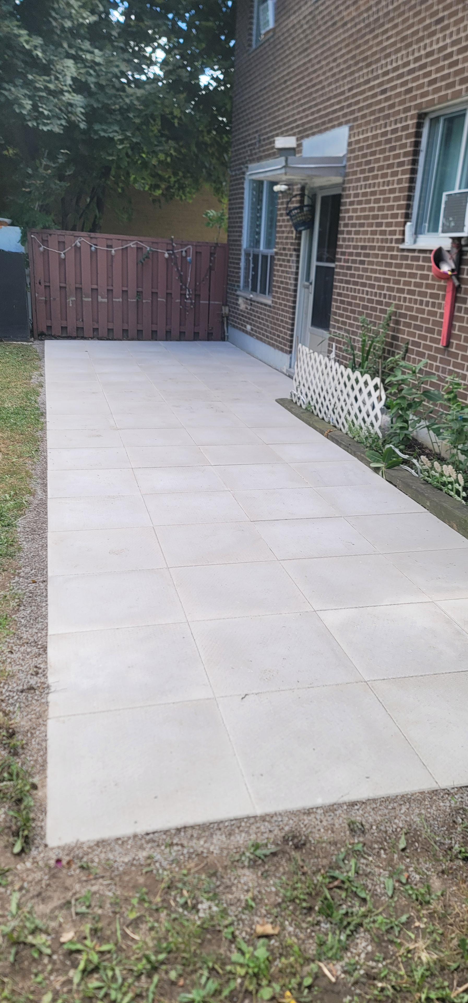 Finished Concrete Pad — Aerial View, Commercial Brick Building
