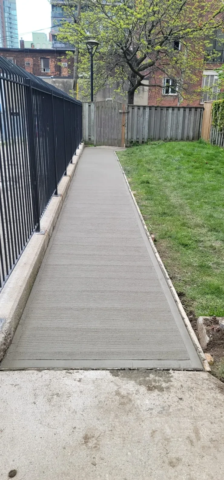 Concrete Walkway — Alongside Iron Fence, Downtown Toronto
