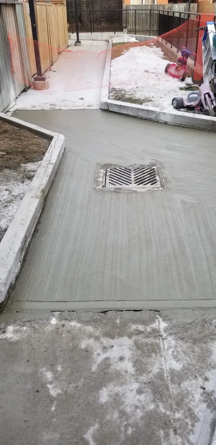 Concrete Driveway with Storm Drain — Finished Paving