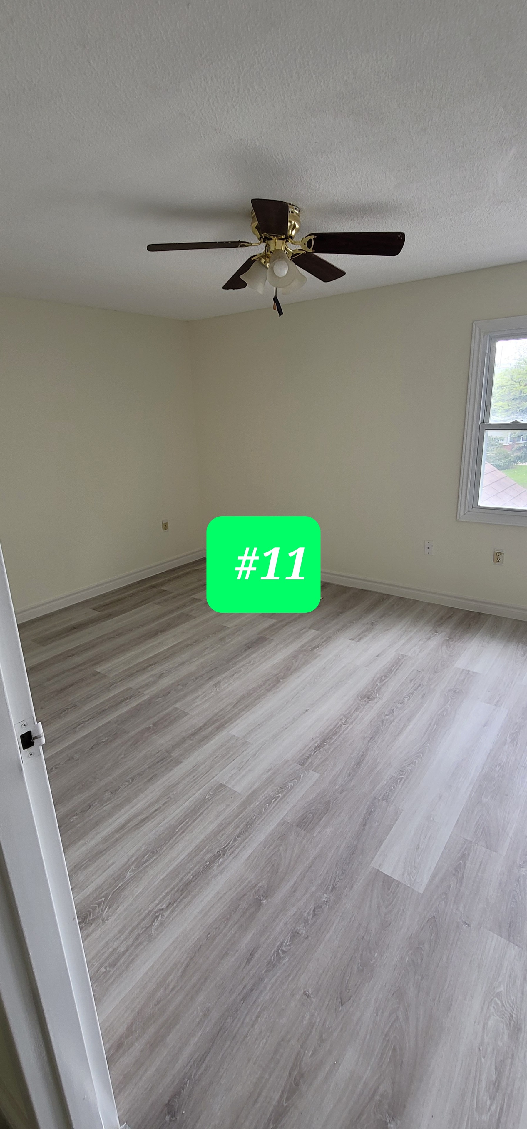 Unit #11 — Bedroom Renovation with New Flooring & Ceiling Fan