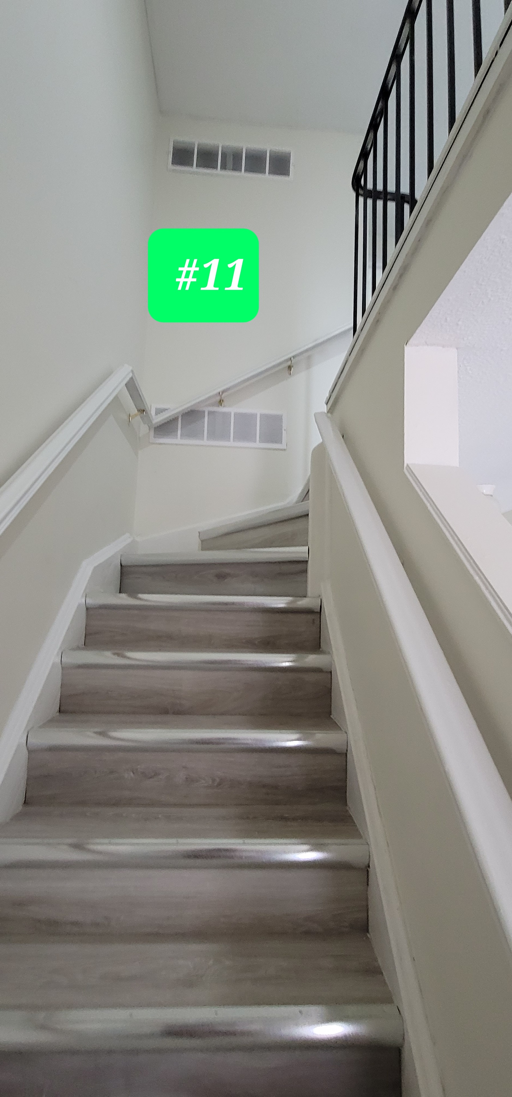 Unit #11 — Stairwell with New Vinyl Plank Flooring