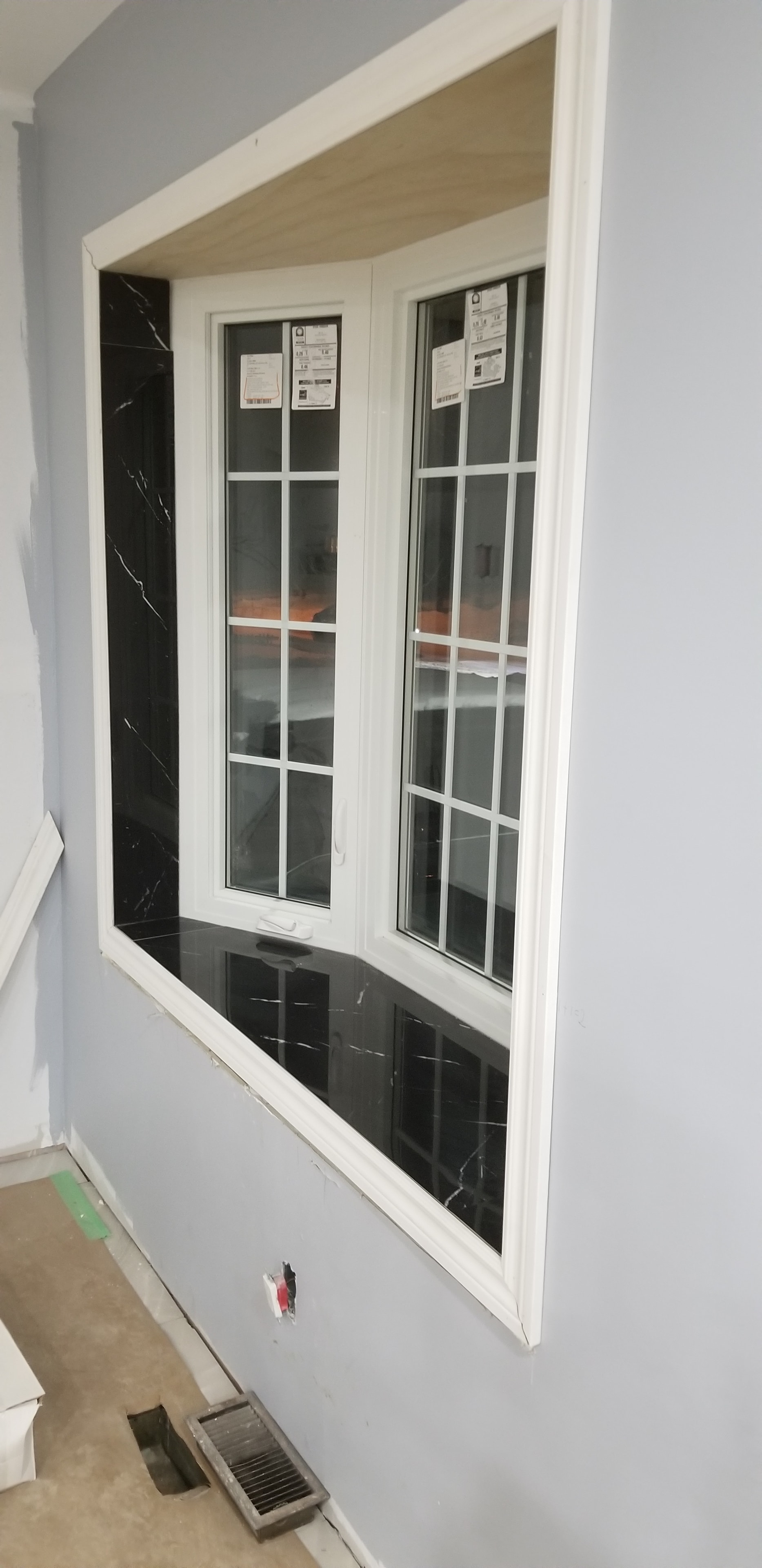 Window Installation with Black Marble Sill — Interior Renovation