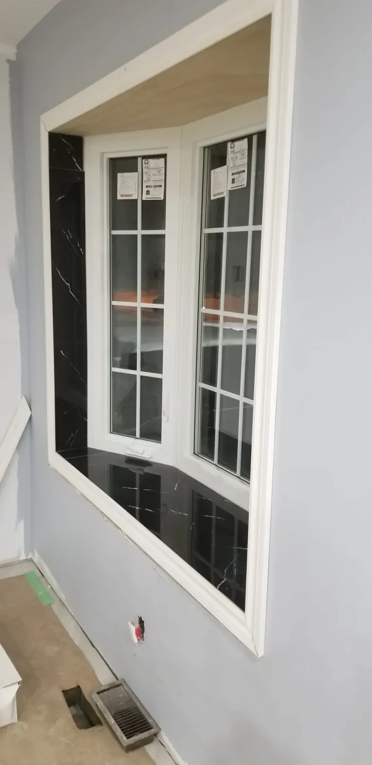 Window Installation — White Frame with Black Marble Sill