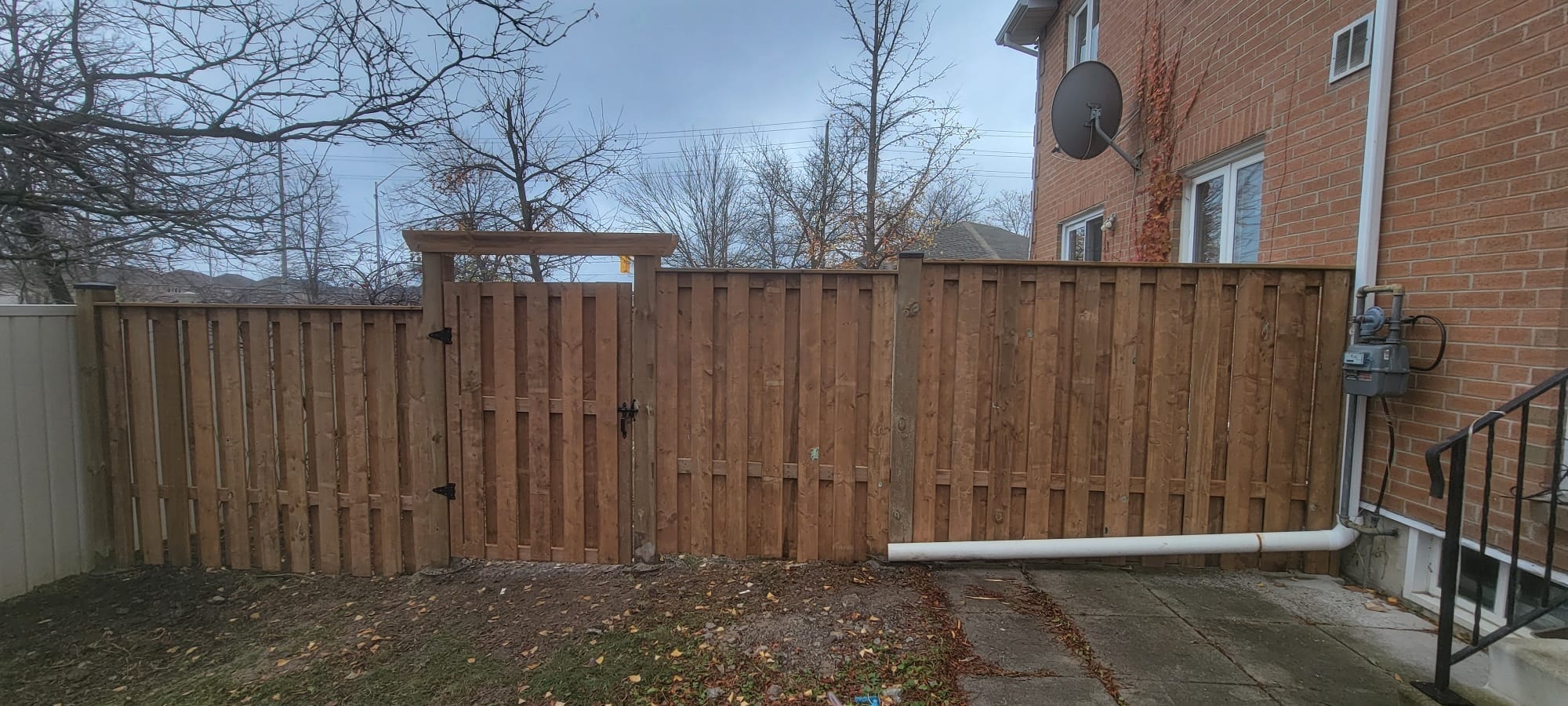 Wood Privacy Fence & Gate — Front View, Commercial Housing Unit