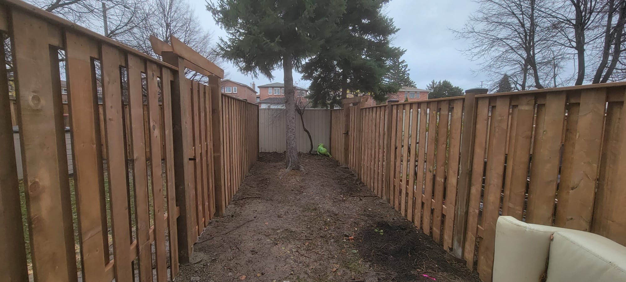 Full Perimeter Wood Fence — Backyard Corridor View, Commercial Housing