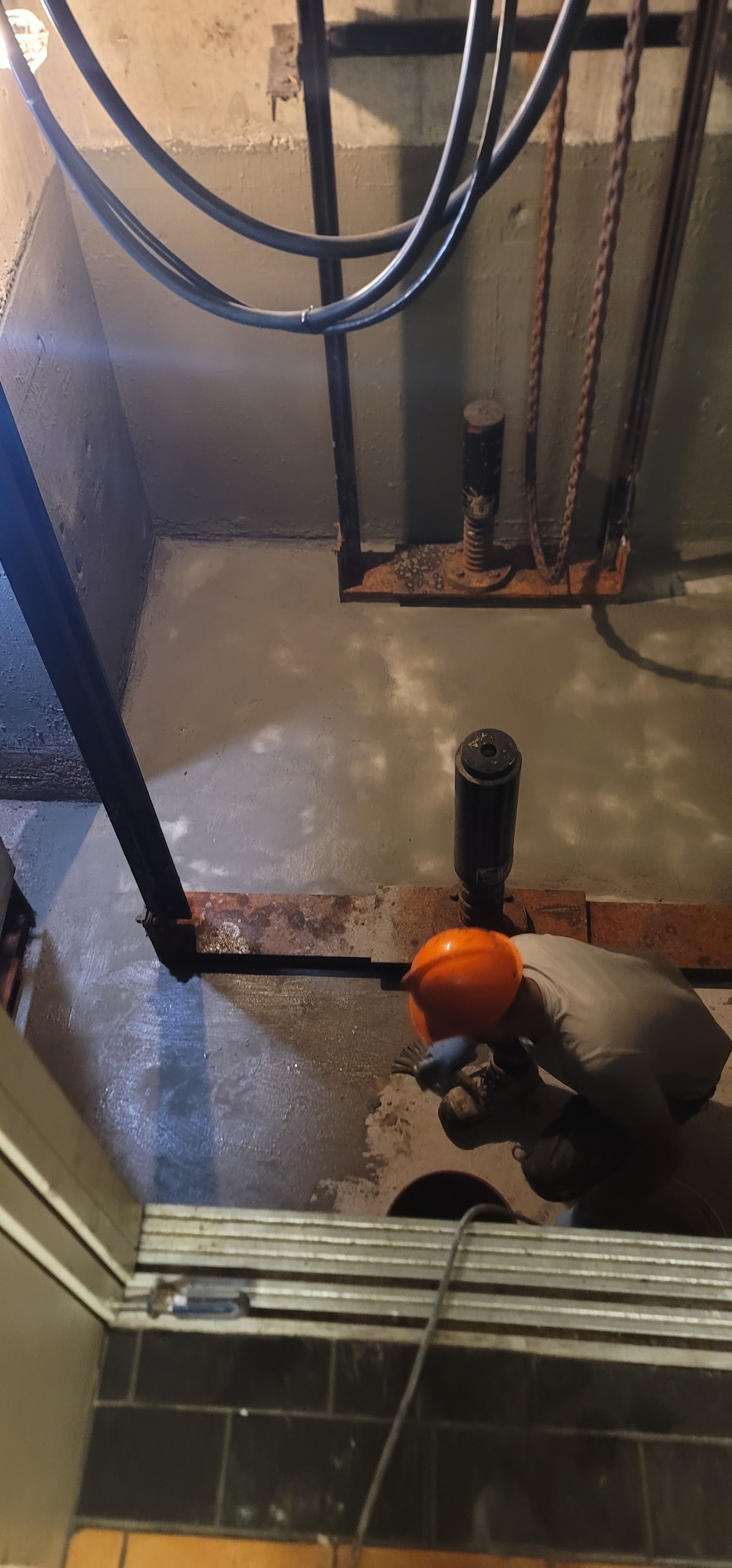 Structural Drilling — Worker in Hard Hat & Gloves, Commercial Building